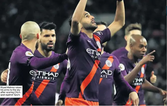  ??  ?? Riyad Mahrez raises his arms to the sky after scoring City’s goal against Spurs