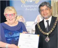  ??  ?? Jan Lewis collected a Community Champion award.