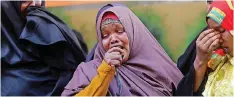  ?? | Reuters ?? A MOTHER of two missing soldiers weeps in Mogadishu, Somalia.