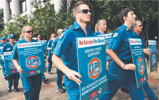  ?? Picture: MARC McCORMACK ?? STRONG MESSAGE: United Voice’s Jen Miran and fellow paramedics protest at the court mention for accused paramedic attacker Timothee Rousselle.