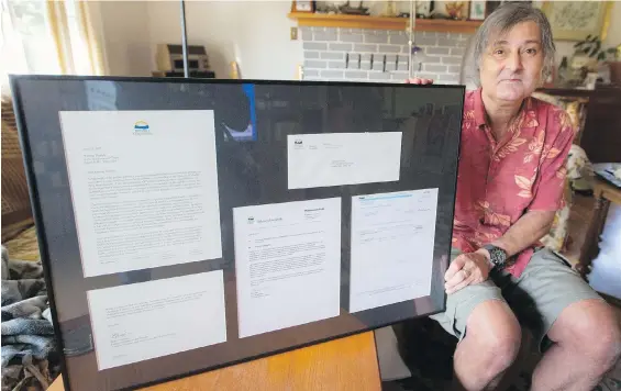  ??  ?? Ramsay Hamdi, with his framed apology letters from the province after he and six others were wrongly fired by the B.C. Health Ministry in 2012.