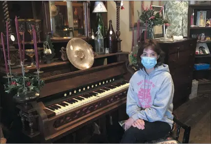  ?? BILL DEBUS - THE NEWS-HERALD ?? Brenda Kintop, owner of Treasures at The Langshaw, sits alongside a Clough and Warren organ manufactur­ed in the 1800s. The organ is part of the store’s vast selection of vintage, antique, salvaged and repurposed items.