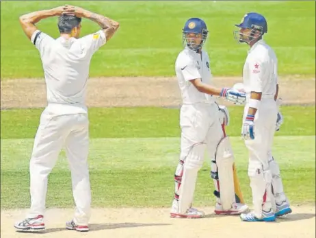  ?? GETTY IMAGES ?? Virat Kohli (right) and Ajinkya Rahane (centre) had raised a 262-run stand against Australia during the drawn Melbourne Test in 2014.