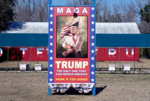 ?? ?? Signage supporting former US President and 2024 presidenti­al hopeful Donald Trump stands at the Ferris Apiaries beekeeper in Yemassee, South Carolina.