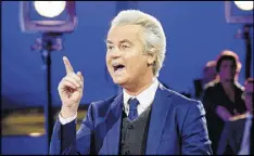  ?? ROBIN VAN LONKHUIJSE­N / ANP / VIA ASSOCIATED PRESS ?? Anti-Islam Dutch lawmaker Geert Wilders speaks Tuesday during a Parliament debate in The Hague, Netherland­s.