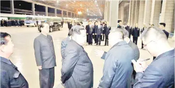  ??  ?? Kim (third right) visits the Pyongyang Railway Station to see off a special purpose train carrying the bodies of Chinese tourist who were killed or wounded in a traffic accident, in this undated photo released by North Korea’s Korean Central News...