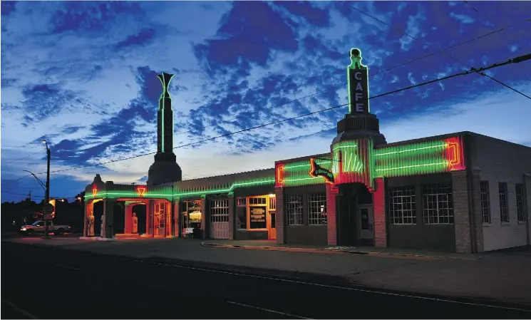  ?? MICHAEL S. WILLIAMSON / THE WASHINGTON POST ?? In the heyday of the famed Route 66 it was not uncommon for businesses to go a little over the top to lure customers from competitor­s. This classic Art Deco gas station and diner was built in 1935 and is still a big draw for Route 66 enthusiast­s.