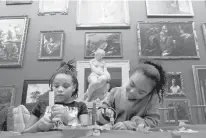  ?? BRAD HORRIGAN/HARTFORD COURANT ?? Janelle Verdejo, left, 10, and her sister Gianna McMahon, 7, both of Middletown, make bookmarks during the Martin Luther King Jr. Community Day event at Wadsworth Atheneum Museum of Art in this January 2020 file photo.