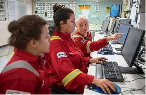  ??  ?? Monitoring conditions: Employees working inside the control room of Cidade de Itaguai at the Santos basin exploratio­n unit of pre-salt fields 240km off the coast of Rio de Janeiro, Brazil. — AFP