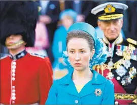 ?? Photograph­s by Des Willie Netf lix ?? THE EYES of the world turn on Princess Anne. “They were calling her frumpy and things like that,” Erin Doherty says of doing research on playing the royal.