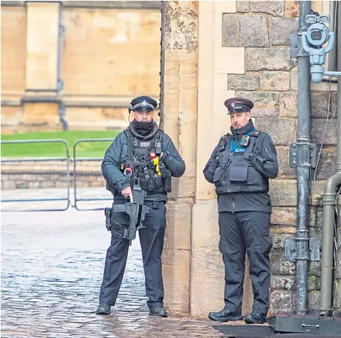  ?? ?? INTRUDER: Armed police at Windsor Castle. Priti Patel, below, has ordered officials to “incorporat­e any lessons” learned into a review of crossbow laws after a man was arrested at the castle while allegedly in possession of one of the weapons.