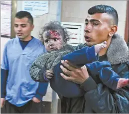  ?? AP photo ?? Palestinia­ns wounded in the Israeli bombardmen­t of the Gaza Strip are brought to Al Aqsa hospital in Deir al Balah, Gaza Strip on Thursday.