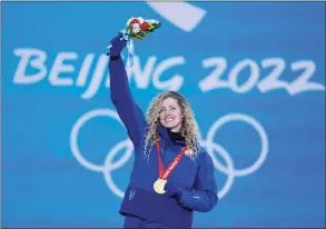  ?? Frank Augstein / Associated Press ?? Lindsey Jacobellis, of Roxbury, acknowledg­es the crowd during a medal ceremony for the women’s snowboard cross finals competitio­n at the 2022 Winter Olympics in Zhang jiakou, China, on Wednesday.