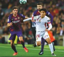  ??  ?? Return...Takefusa Kubo in action against his former club Barcelona