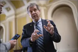  ?? J. SCOTT APPLEWHITE — THE ASSOCIATED PRESS FILE ?? Senate Banking Committee Chairman Sherrod Brown, D-Ohio, takes questions from reporters at the Capitol in Washington on Wednesday.