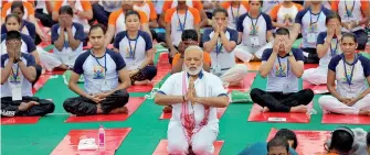  ??  ?? Indian Prime Minister Narendra Modi performs yoga on Internatio­nal Yoga Day in Lucknow, India June 21, 2017. Reuters/Pawan Kumar/File Photo