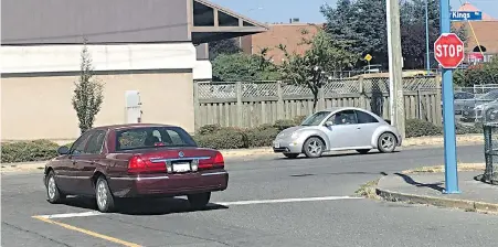  ??  ?? At stop signs, it’s the law to stop behind the white line. Another stop might be required to look for oncoming traffic, Steve Wallace writes.