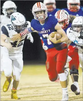  ?? Erik Verduzco ?? Las Vegas Review-journal @Erik_verduzco Liberty quarterbac­k Kenyon Oblad (7), running against Foothill in an October game, is the state’s career leader in passing yards.