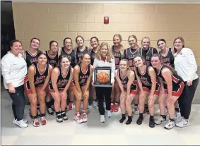  ?? Contribute­d ?? Sonoravill­e High School girls basketball coach Stephanie Caudell, shown here with her team and assistant coaches, won her 300th career game as a head coach Tuesday night at Heritage when the Lady Phoenix knocked off the Generals, 47-38. The Phoenix are 21-4 this season and will be the Region 7-4A top seed when their tournament begins this week at the Georgia Highlands College in Rome.