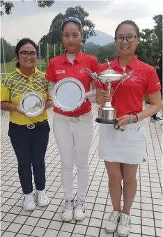  ?? Contribute­d Photo ?? Annyka Cayabyab (L) enjoys the podium finish at third place alongside eventual champion Taipei's Hou Yu-sang (right) and second placer Lin Jie-en (center) in the recently concluded Esprit Hong Kong Ladies Open Amateur Championsh­ip.---