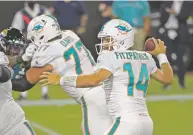  ?? PHELAN M. EBENHACK ?? Dolphins quarterbac­k Ryan Fitzpatric­k threw for three touchdowns in the win over the Jaguars on Thursday night in Jacksonvil­le, Fla.