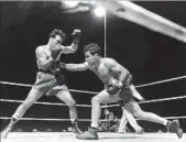  ?? Associated Press ?? JAKE LAMOTTA, right, knocked out Marcel Cerdan for the middleweig­ht title in 1949.