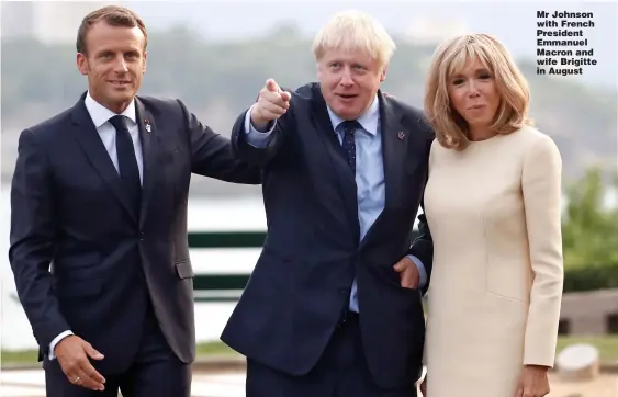  ?? Picture: CHRISTIAN HARTMANN/REUTERS ?? Mr Johnson with French President Emmanuel Macron and wife Brigitte in August