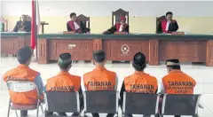  ?? REUTERS ?? Five men, part of a gang of 14 men and boys, convicted for the rape and murder of a 14-year-old girl sit before judges during sentencing in Curup on Thursday.