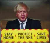  ?? LEON NEAL — POOL VIA AP ?? Britain’s Prime Minister Boris Johnson announced Friday that the new variant of COVID-19 may be linked with an increase in the mortality rate.