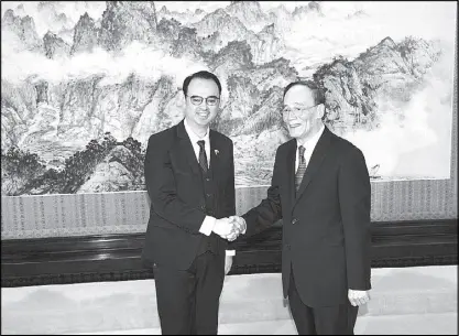  ??  ?? Foreign Affairs Secretary Alan Peter Cayetano, left, shakes hands with Chinese Vice President Wang Qishan before a meeting at the Zhongnanha­i Leadership Compound in Beijing yesterday. AP