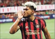  ??  ?? Atlanta United forward Josef Martinez gestures towards the crowd after scoring a goal in second half of an MLS Eastern Conference Semifinal playoff match against the Philadelph­ia Union in Atlanta, in 2019.