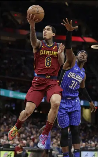  ?? TONY DEJAK — THE ASSOCIATED PRESS ?? The Cavaliers’ Jordan Clarkson drives against the Magic’s Terrence Ross in the first half March 3 at Quicken Loans Arena.