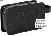  ??  ?? Gucci GG Embossed Travel Case