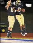  ?? BARRY TAGLIEBER - FOR DFM ?? Spring-Ford’s Juantoni Browne (25) and Dante Bonanni (10) celebrate after a touchdown against Wayne Valley.