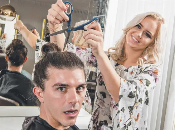  ?? Picture: JERAD WILLIAMS ?? The man bun on Gold Coast blokes such as Brodie Green are no longer safe with Ette Studio stylist Jordyn Reay donating the hair to charity