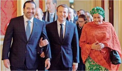  ?? AFP ?? French President Emmanuel Macron with Saad Hariri and UN Deputy Secretary General Amina Mohammed as they arrive to attend the Lebanon Internatio­nal Support Group meeting in Paris on Friday. —