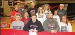  ?? ?? McDonald County senior Jack Parnell, seated between his parents, Sara Fields and Will Parnell, and accompanie­d by members of his family, signed his letter of intent to play football at Benedictin­e College in Atchison, Kan.