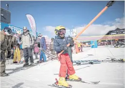  ??  ?? AIMING HIGH: Thabang Mabari, 10, from Lesotho, holds the T-bar of the ski-lift.