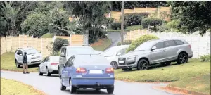  ?? PICTURE: LEON LESTRADE/AFRICAN NEWS AGENCY (ANA) ?? CRIME SCENE: Family and friends arrive at the Randeree home in Westville North yesterday, after the property was stormed the previous night by a gang of robbers. Rookaya Desai was shot dead during the robbery.