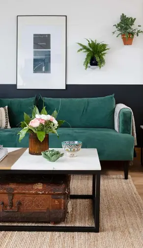  ??  ?? LIVING ROOM
Above A green velvet Maisons du Monde sofa is dressed with Habitat cushions. Beneath the marble-topped coffee table from Swoon, a vintage chest from a movie set provides extra storage. The dark paint stripe on the bottom of the walls is Tempest’s Teapot by Valspar Above right Ikea chairs bring a cosy mid-century feel, along with a 1960s Arco lamp, rewired and updated with a new shade