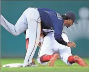  ??  ?? Manuel Balce Ceneta / The Associated PressAtlan­ta Braves second baseman Ozzie Albies (1) tags out Washington’s Howie Kendrick (4) as Kendrick tried to steal second base during the first inning of Tuesday’s game.