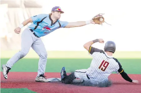  ?? CHRISTIAN J. STEWART ?? Knights base runner Jordan Qsar slides safely into second ahead of the throw to HarbourCat­s shortstop Tucker Johnson during Game 3 in Corvallis, Oregon, on Tuesday night.