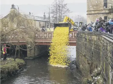  ??  ?? FLASHBACK: Hebden Bridge Rotary Club’s Easter Monday Duck Race attracted hundreds of spectactor­s to watch plastic ducks bob along the river. The event will be online this year due to the Covid pandemic.