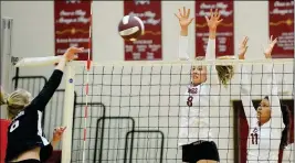  ??  ?? ABOVE: KOFA’S KEILEY SHARP (8) and Kassandra Dominguez (11) up in the air to defend against a shot by Boulder Creek’s Taylor Pratt during the first set of Thursday night’s match inside Ernest F. Rillos Gym. RIGHT: Kofa’s Keiley Sharp serves the ball during the first set of Thursday night’s match.