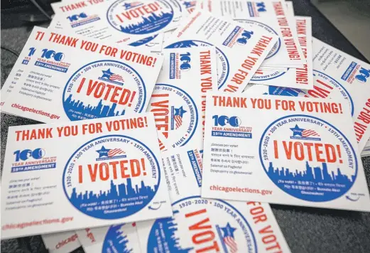  ?? KAMIL KRZACZYNSK­I/AFP VIA GETTY IMAGES ?? “I voted” stickers at the Chicago Board of Elections’ Loop Super Site for early voting on Oct. 1, 2020.