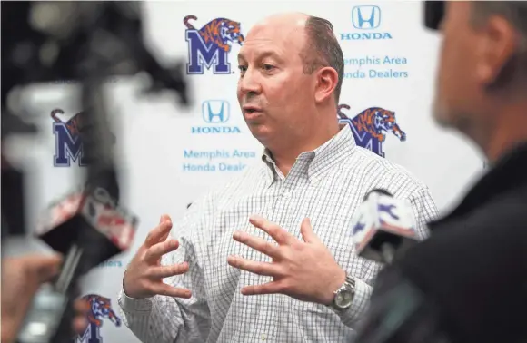  ??  ?? Memphis special teams coordinato­r Pete Lembo talks to reporters during a press conference on Saturday. JOE RONDONE/THE COMMERCIAL APPEAL