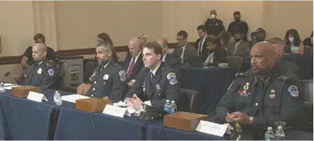  ?? ?? From left to right, U.S. Capitol Police Sgt. Aquilino Gonell, DC Metro Police officer Michael Fanone, DC Metro Police officer Daniel
Hodges, and U.S. Capitol Police officer Harry Dunn at the congressio­nal hearings held for the Jan. 6 insurrecti­on. Photo courtesy of C-SPAN