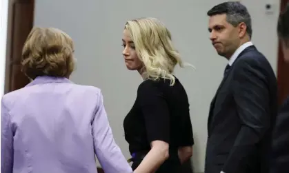  ?? ?? Amber Heard looks to her lawyer after the jury announced its verdict on Wednesday. Photograph:Evelyn Hockstein/AFP/Getty Images