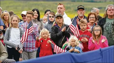  ?? DOUG MILLS / THE NEW YORK TIMES ?? Attendees look on during a ceremony on the 17th anniversar­y of the Sept. 11 terrorist attacks at the Flight 93 National Memorial in Shanksvill­e, Pa., on Tuesday. The president and the first lady were in attendance.