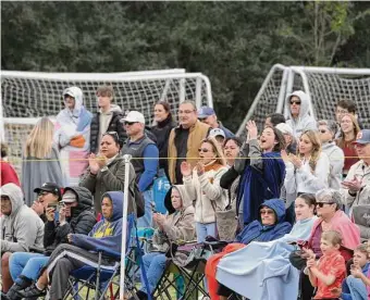  ?? Doug Sweet Jr./Contributo­r ?? Fans cheer as The Woodlands Youth Rugby Club has a successful try against the West Houston Rugby Club. The Woodlands is one of the nation’s leading youth sports destinatio­ns.